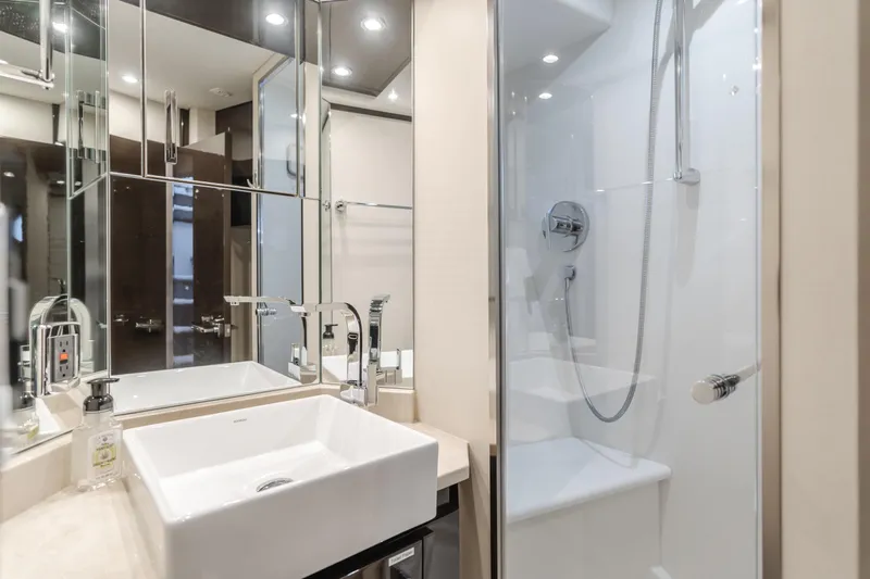 Fine Seas-onings Yacht Photos Pics Luxurious bathroom in 2018 Marquis 720 Fly yacht with modern fixtures and glass shower.