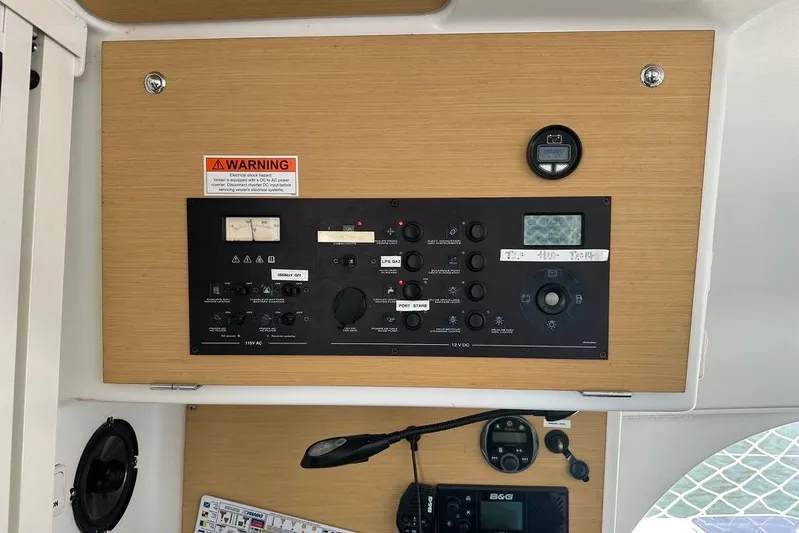 Alice Yacht Photos Pics Control panel of a 2015 Lagoon 380 S2 catamaran with warning label and instruments.