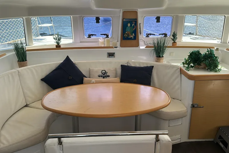 Alice Yacht Photos Pics Interior of 2015 Lagoon 380 S2 catamaran with cozy seating and nautical decor.