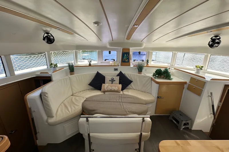 Alice Yacht Photos Pics Interior of 2015 Lagoon 380 S2 catamaran with cozy seating and decorative plants.