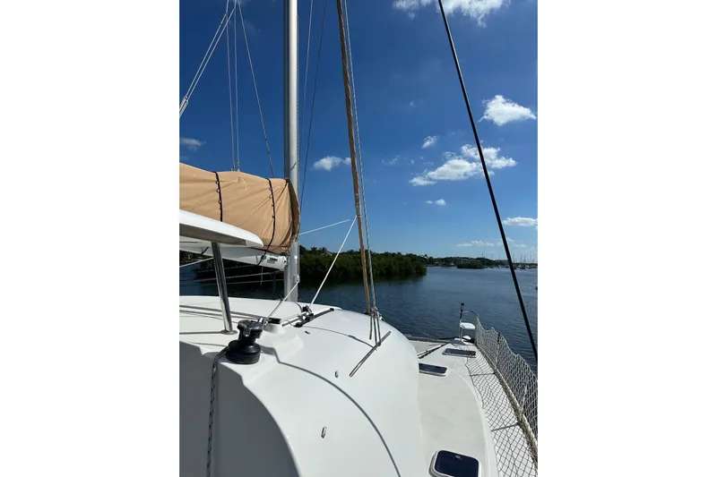 Alice Yacht Photos Pics 2015 Lagoon 380 S2 catamaran sailing on a sunny day with clear blue skies.