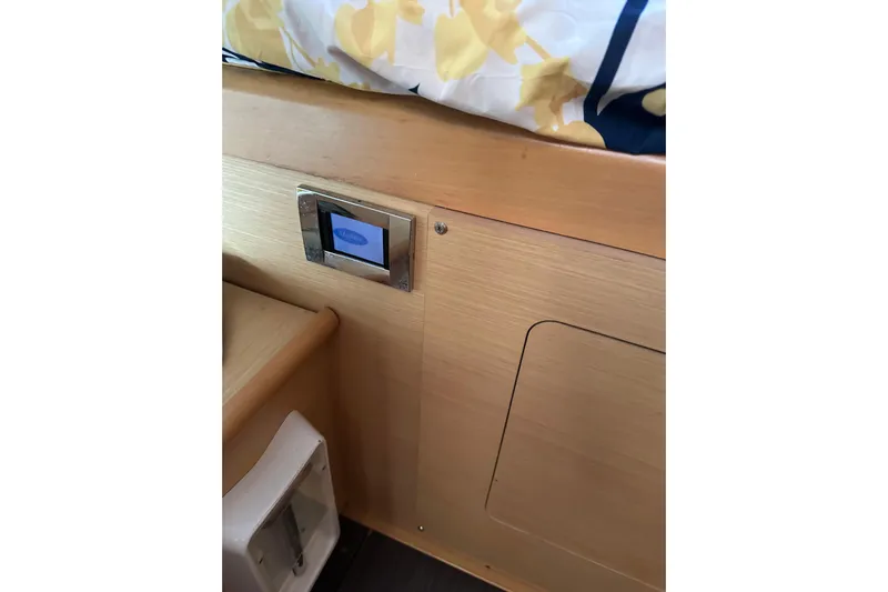 Alice Yacht Photos Pics Interior of 2015 Lagoon 380 S2 yacht with wooden paneling and control panel.