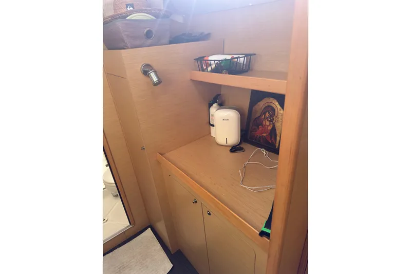 Alice Yacht Photos Pics Interior of 2015 Lagoon 380 S2 yacht bathroom with wooden cabinetry and decor.