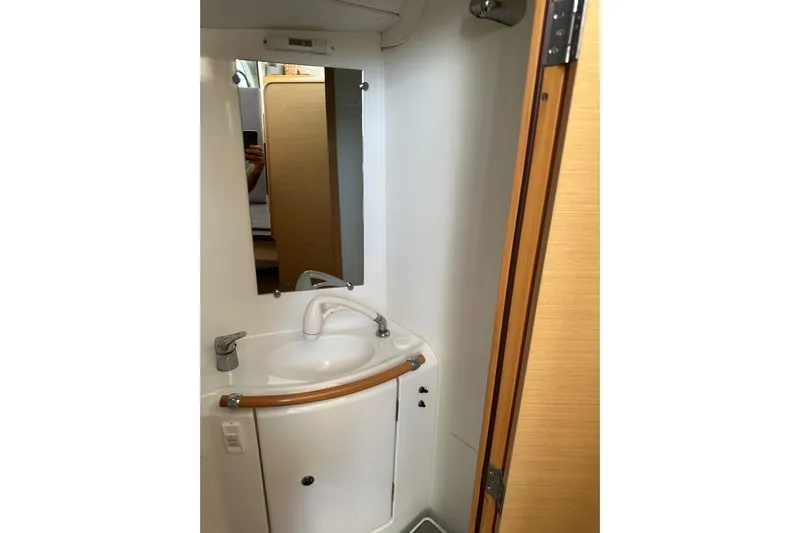 Alice Yacht Photos Pics Bathroom interior of 2015 Lagoon 380 S2 yacht with sink and mirror.