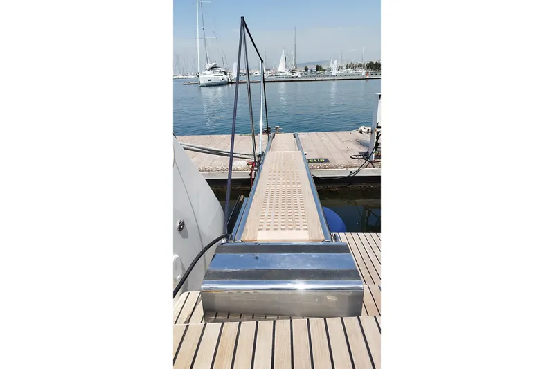  Yacht Photos Pics Lagoon 46 catamaran gangway leading to dock, 2021 model, marina view.