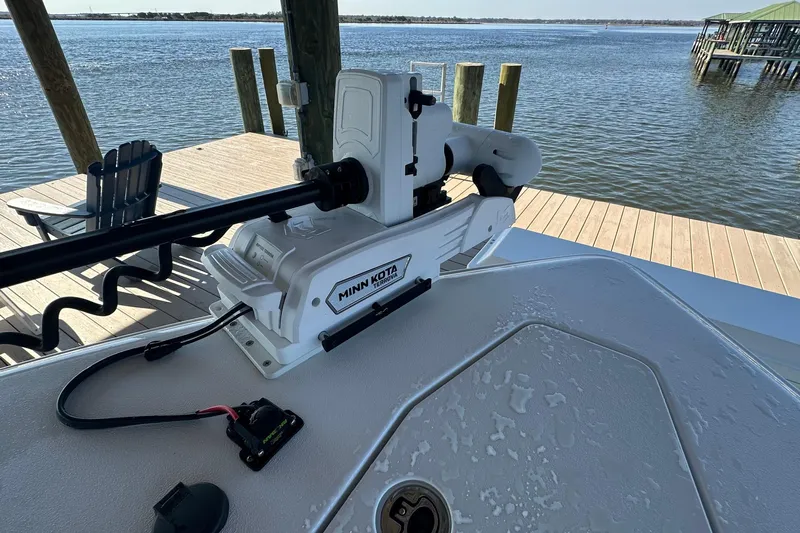  Yacht Photos Pics 2024 Sea Hunt Gamefish 30 with Minn Kota trolling motor on a docked boat.