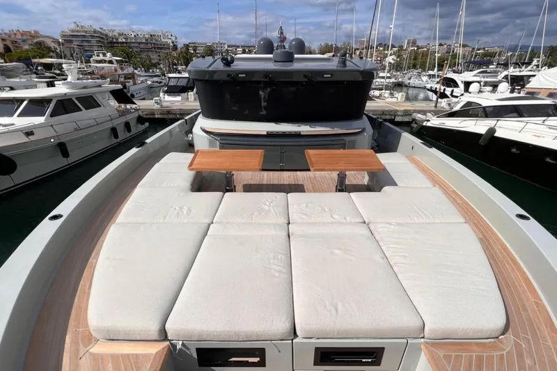  Yacht Photos Pics 2020 Bluegame BGX 70 yacht with spacious deck and seating in a marina setting.