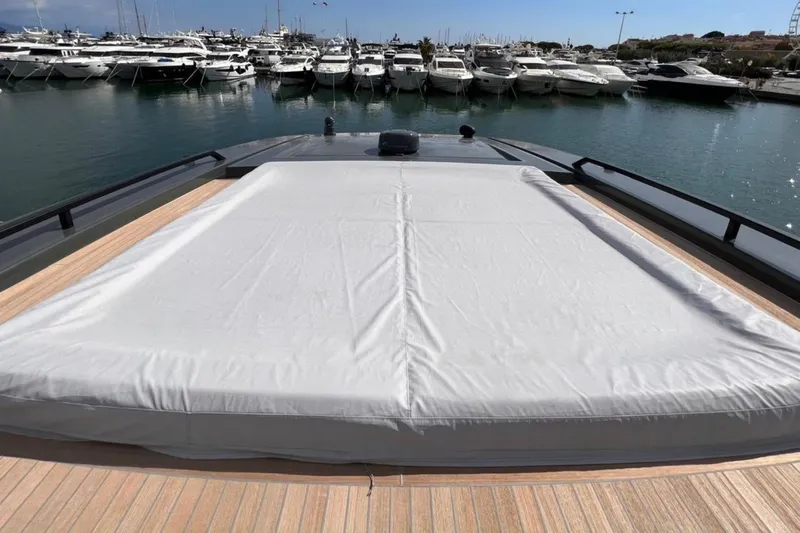  Yacht Photos Pics Luxury yacht Bluegame BGX 70 (2020) with covered deck, docked in marina.