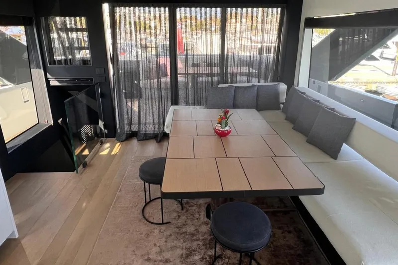  Yacht Photos Pics Luxurious interior of 2020 Bluegame BGX 70 yacht with elegant dining area and modern decor.