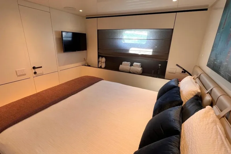  Yacht Photos Pics Luxurious bedroom interior of 2020 Bluegame BGX 70 yacht with modern decor.