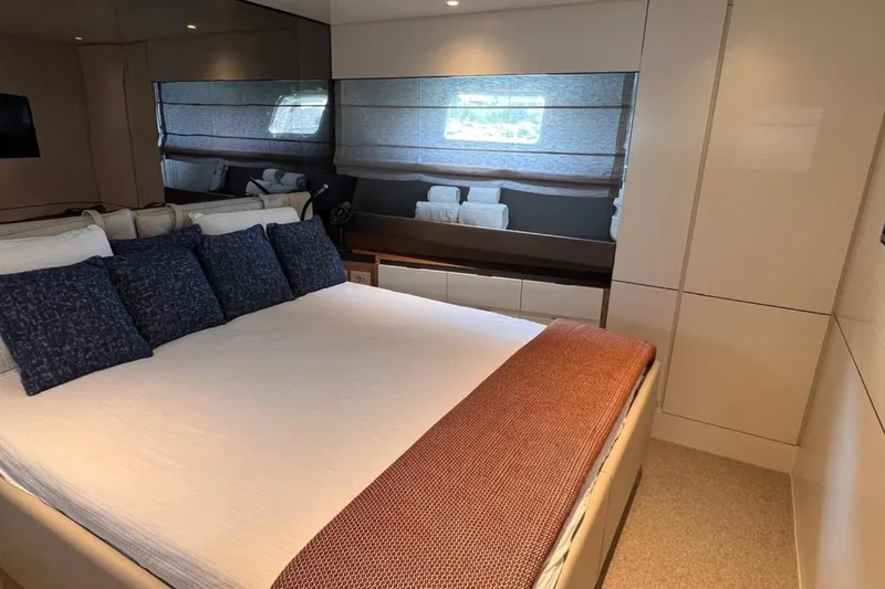  Yacht Photos Pics Luxurious bedroom interior of 2020 Bluegame BGX 70 yacht with modern decor.