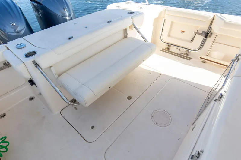 No Name Yacht Photos Pics 2022 Grady-White 326 CANYON boat interior with foldable seating and twin engines.