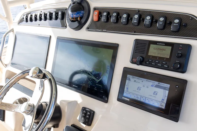 No Name Yacht Photos Pics Grady-White 326 CANYON 2022 boat dashboard with navigation and control systems.