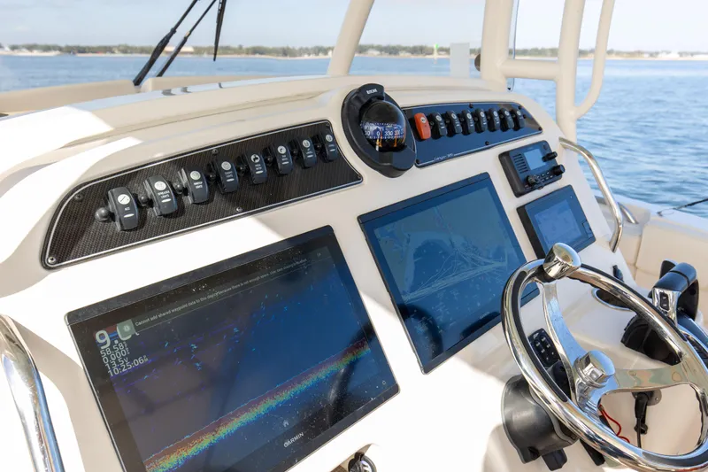 No Name Yacht Photos Pics 2022 Grady-White 326 CANYON boat dashboard with advanced navigation screens and controls.