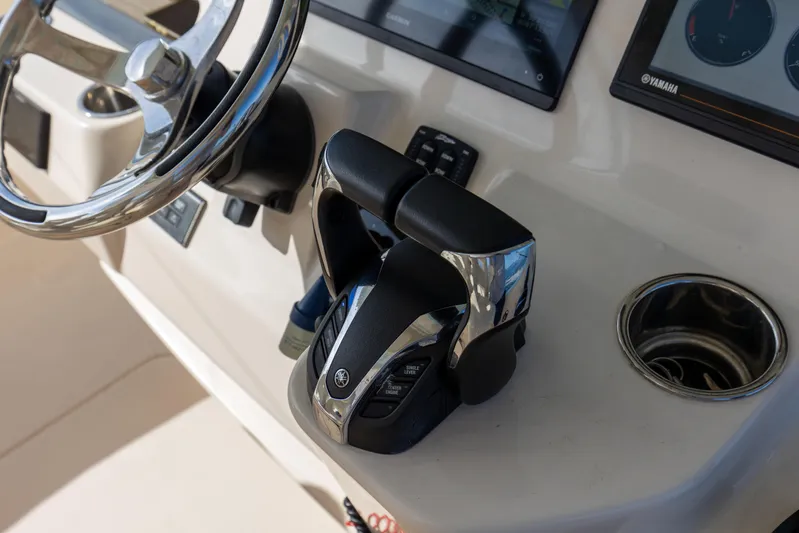 No Name Yacht Photos Pics Grady-White 326 CANYON 2022 boat helm with steering wheel and controls.