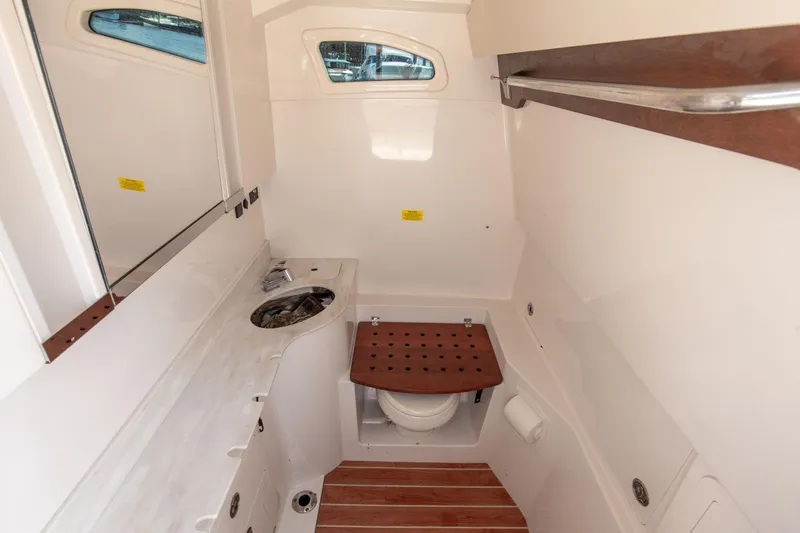 No Name Yacht Photos Pics 2022 Grady-White 326 CANYON boat interior with sink and toilet.