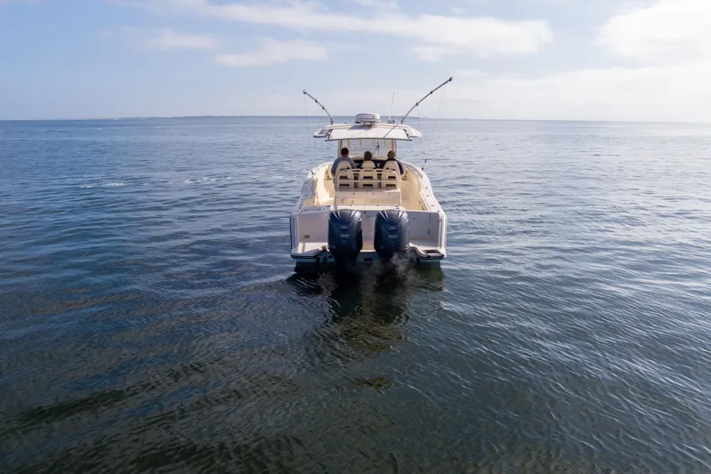 No Name Yacht Photos Pics 2022 Grady-White 326 CANYON boat on open water, rear view.