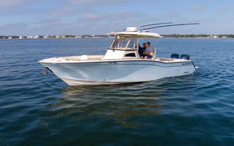 No Name Yacht Photos Pics 2022 Grady-White 326 CANYON boat cruising on calm waters.