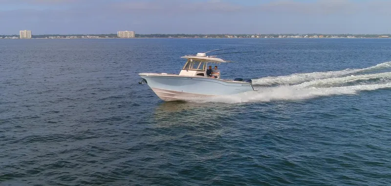 No Name Yacht Photos Pics 2022 Grady-White 326 CANYON boat cruising on open water.