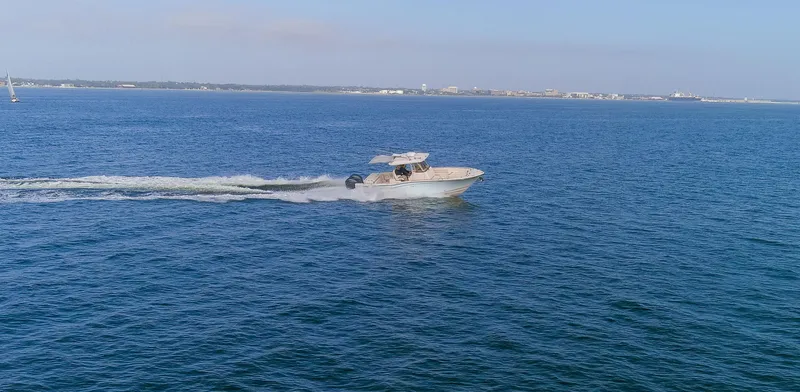 No Name Yacht Photos Pics Grady-White 326 CANYON 2022 boat cruising on open blue water.