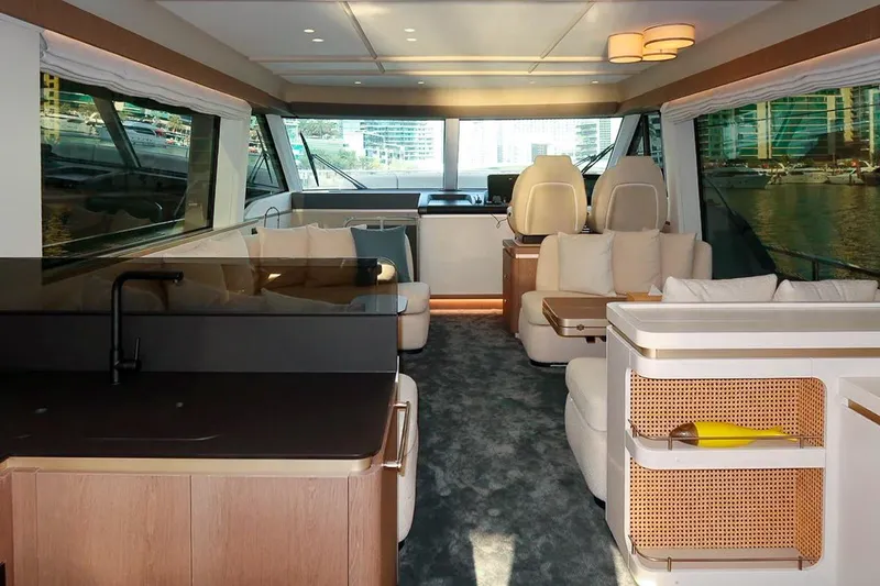 Azimut Magellano 60 Model 2025 Yacht Photos Pics Luxurious interior of 2025 Azimut Magellano 60 yacht with modern furnishings and panoramic windows.
