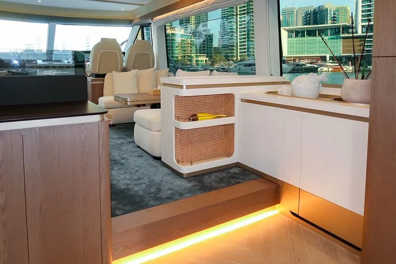 Azimut Magellano 60 Model 2025 Yacht Photos Pics Luxurious interior of 2025 Azimut Magellano 60 yacht with modern furnishings and large windows.