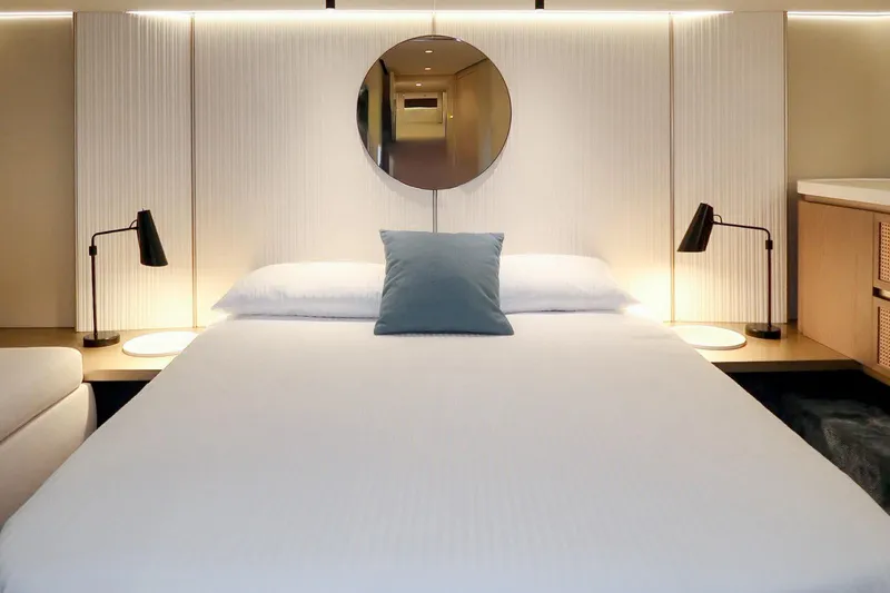 Azimut Magellano 60 Model 2025 Yacht Photos Pics Luxurious bedroom interior of 2025 Azimut Magellano 60 yacht with modern design elements.