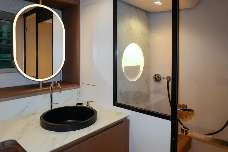 Azimut Magellano 60 Model 2025 Yacht Photos Pics Luxurious bathroom on 2025 Azimut Magellano 60 yacht with modern fixtures and elegant design.