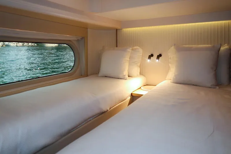 Azimut Magellano 60 Model 2025 Yacht Photos Pics Luxurious twin cabin in 2025 Azimut Magellano 60 yacht with ocean view.