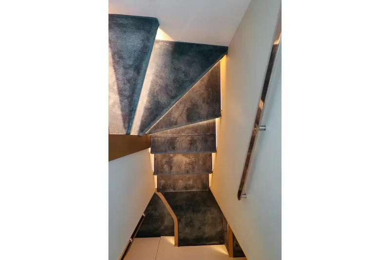 Azimut Magellano 60 Model 2025 Yacht Photos Pics Staircase with modern lighting on Azimut Magellano 60 yacht, 2025 model.