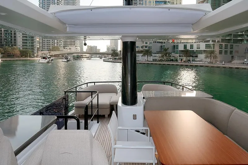 Azimut Magellano 60 Model 2025 Yacht Photos Pics Luxurious 2025 Azimut Magellano 60 yacht interior with waterfront city view.