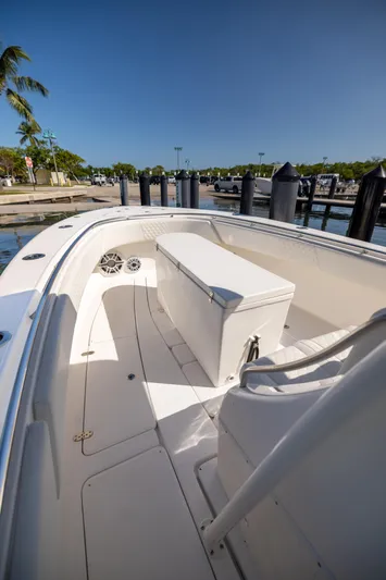  Yacht Photos Pics 2007 Fountain 34 Center Console boat docked at marina under clear blue sky.