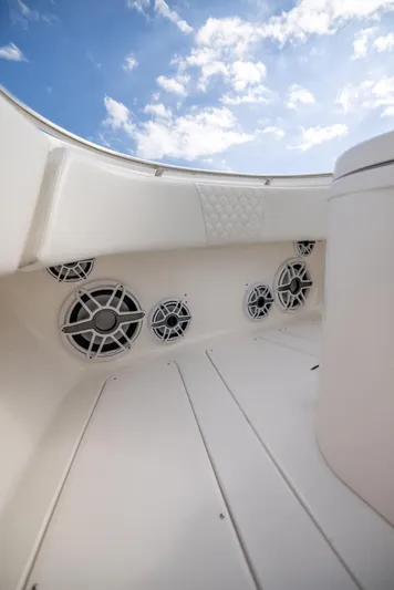  Yacht Photos Pics 2007 Fountain 34 Center Console boat interior with speakers and blue sky.