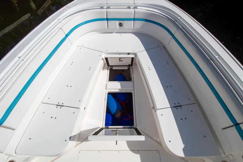 Ami Kids Donation Yacht Photos Pics 2015 Intrepid 327 Center Console boat deck with storage compartments open.