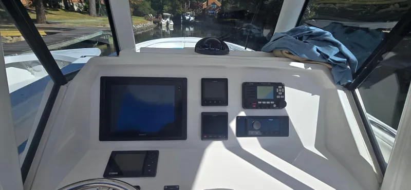 Ami Kids Donation Yacht Photos Pics 2015 Intrepid 327 Center Console dashboard with navigation and control panels.