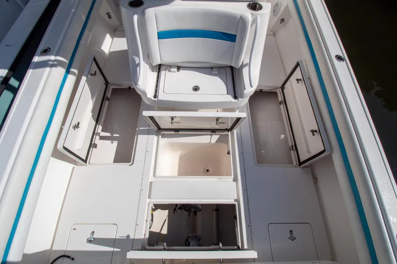 Ami Kids Donation Yacht Photos Pics 2015 Intrepid 327 Center Console boat interior with open storage compartments.