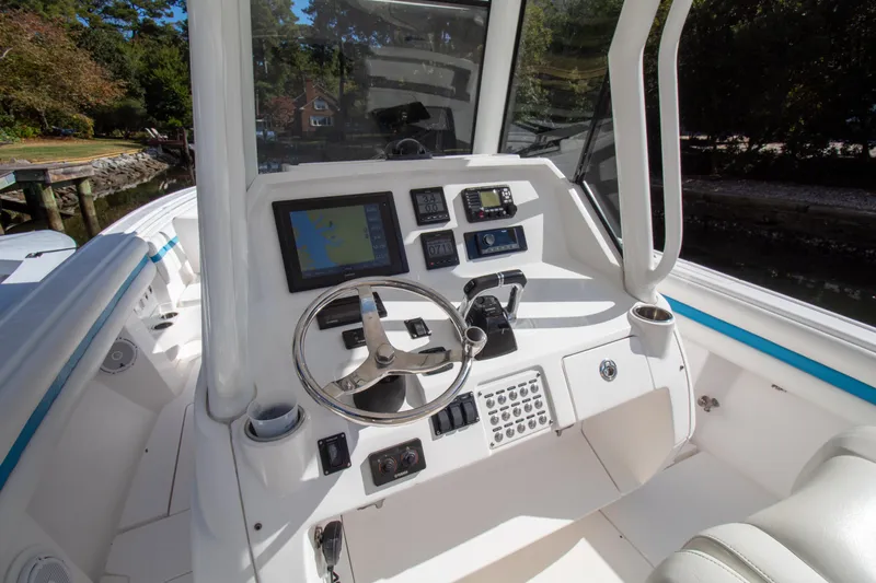 Ami Kids Donation Yacht Photos Pics 2015 Intrepid 327 Center Console boat dashboard with navigation equipment.