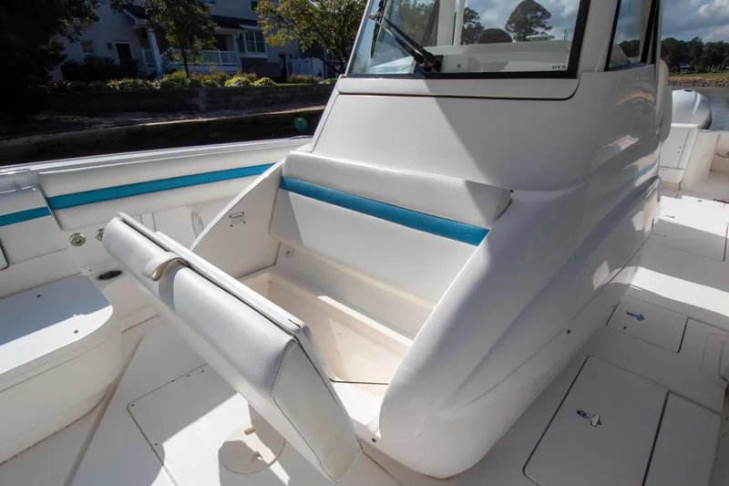 Ami Kids Donation Yacht Photos Pics 2015 Intrepid 327 Center Console boat interior with seating and storage.