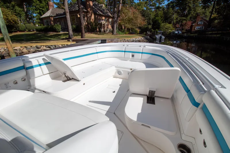 Ami Kids Donation Yacht Photos Pics 2015 Intrepid 327 Center Console boat interior with white seating and blue accents.