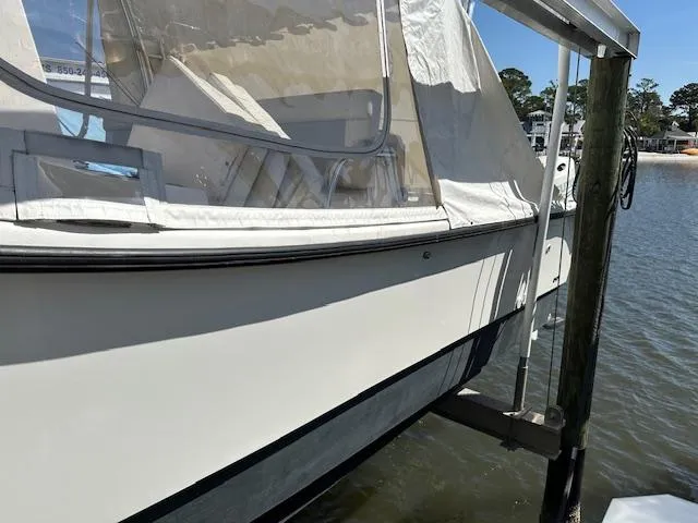  Yacht Photos Pics 2021 AmeraCat 27 Gen II DC boat docked by the water.