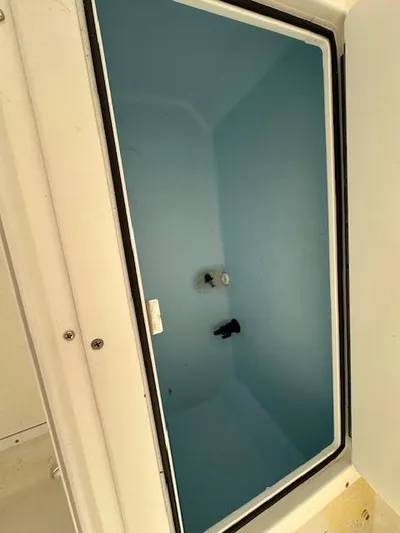  Yacht Photos Pics 2021 AmeraCat 27 Gen II DC boat storage compartment, open lid, blue interior.