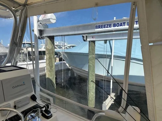  Yacht Photos Pics 2021 AmeraCat 27 Gen II DC on boat lift, viewed from cockpit with Garmin equipment.