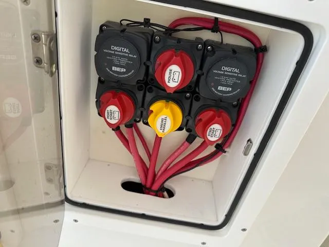  Yacht Photos Pics Electrical panel with switches and cables on a 2021 AmeraCat 27 Gen II DC boat.