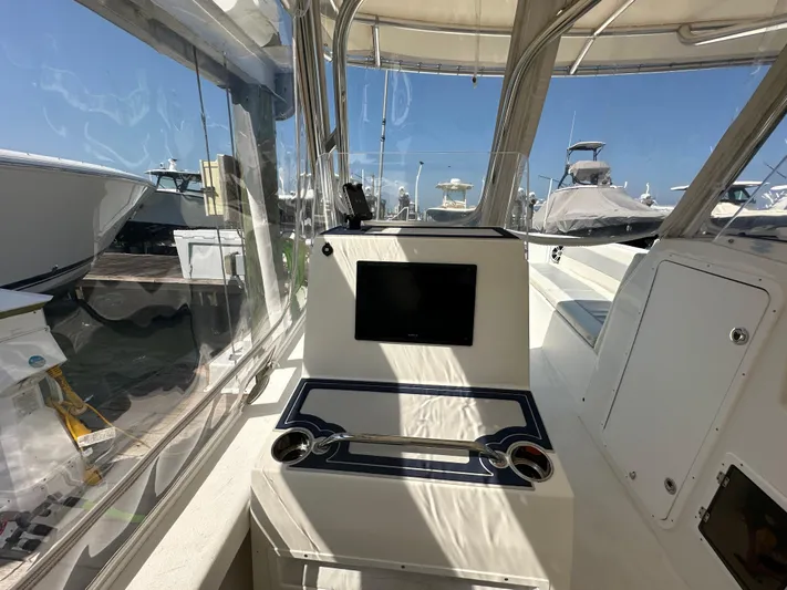  Yacht Photos Pics 2021 AmeraCat 27 Gen II DC boat interior with control panel and seating area.