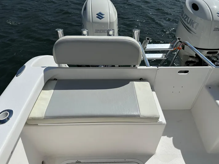  Yacht Photos Pics 2021 AmeraCat 27 Gen II DC boat with Suzuki engines, featuring a cushioned seating area.