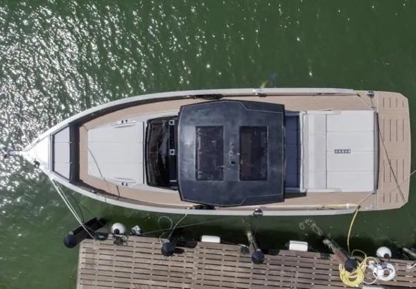  Yacht Photos Pics Overhead view of 2022 De Antonio Yachts D42 docked on green water.
