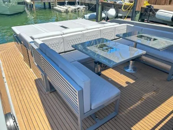  Yacht Photos Pics Luxury seating area on 2022 De Antonio Yachts D42 with modern design and glass tables.