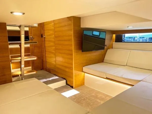  Yacht Photos Pics Luxurious interior of 2022 De Antonio Yachts D42 with modern seating and wooden accents.