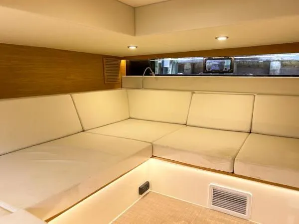  Yacht Photos Pics Luxurious interior of 2022 De Antonio Yachts D42 with plush seating and modern lighting.