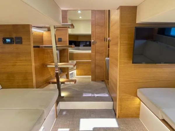  Yacht Photos Pics Interior of 2022 De Antonio Yachts D42, featuring modern wood finishes and comfortable seating.